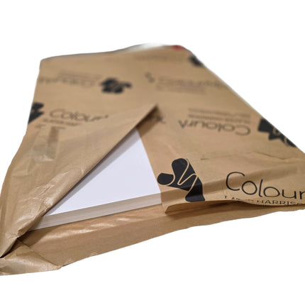 Brown envelope with white paper inside, branded 'Colour M'.