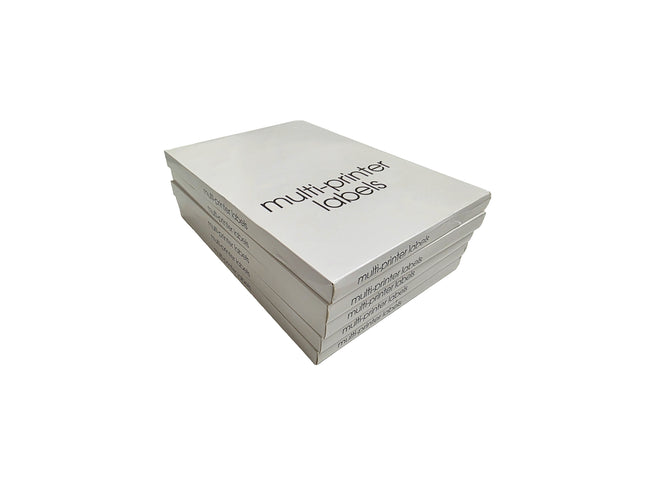 Stack of white label sheets with 'multi-prINTER labels' text on a white background