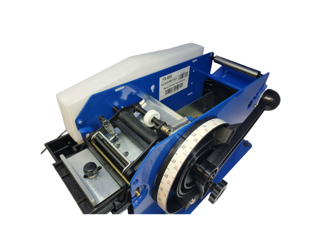 Close-up of a blue label printer on a white background