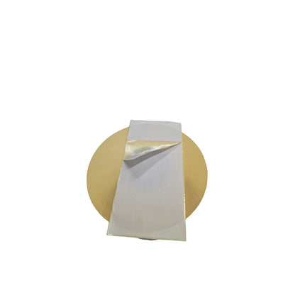White napkin on a round wooden coaster with a white background