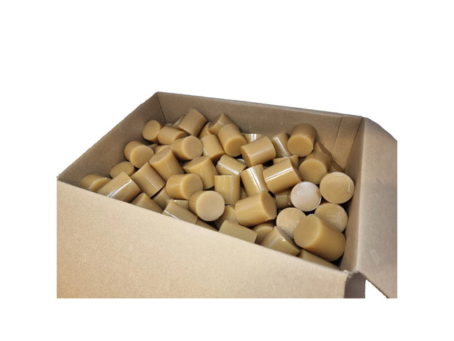 Box of cylindrical beige objects on a white background
