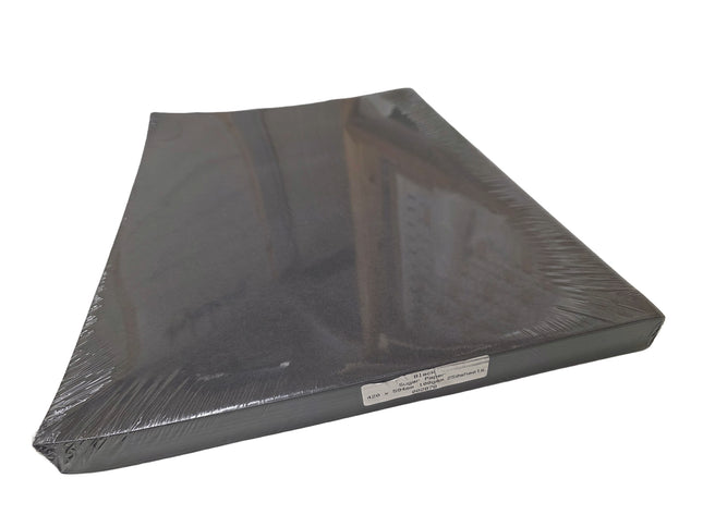 Black plastic sheet with a label on a white background