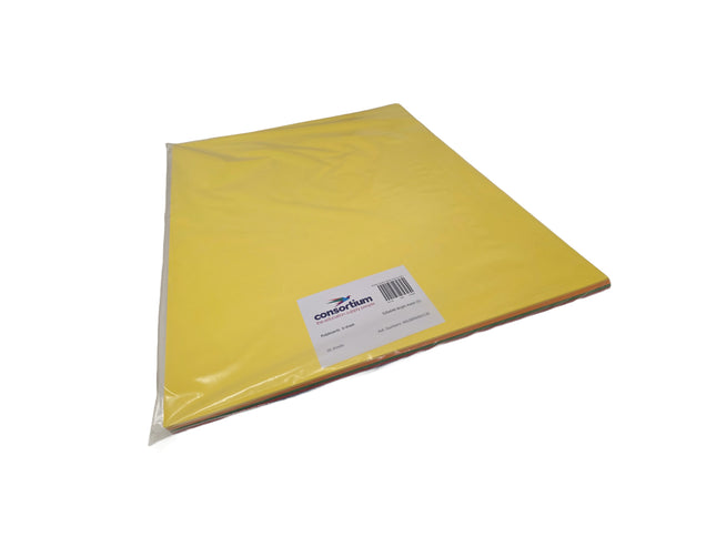 Yellow sheet of paper with a label on a white background