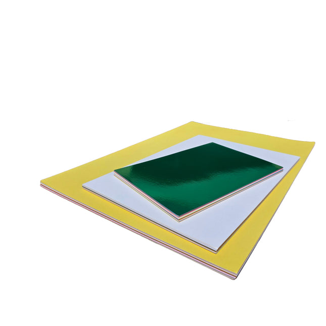 Stack of green and yellow books on a white background